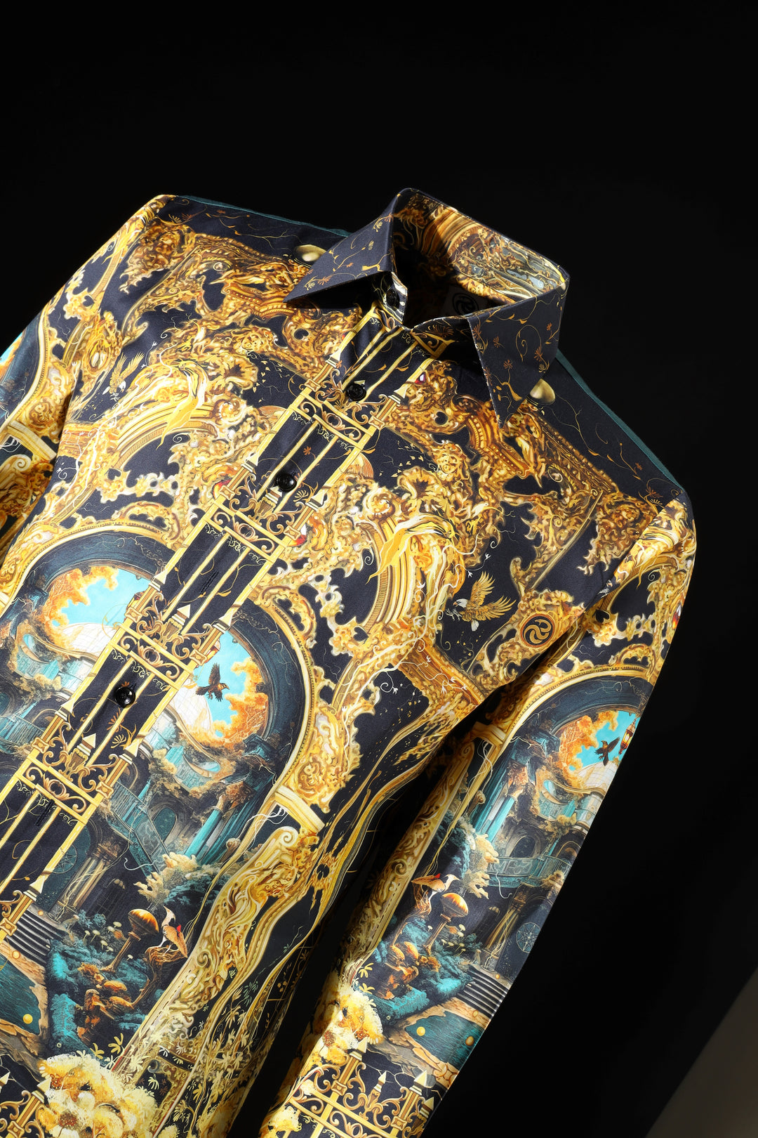 Decorative folded paper with intricate gold and blue designs on a black background LoudLess