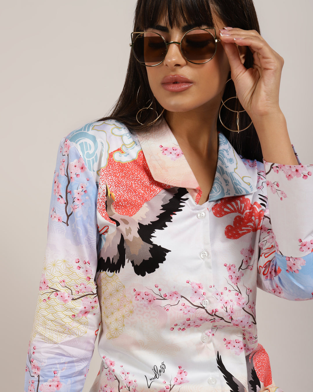 Get a trendy look with this LoudLess Japanese printed women's top