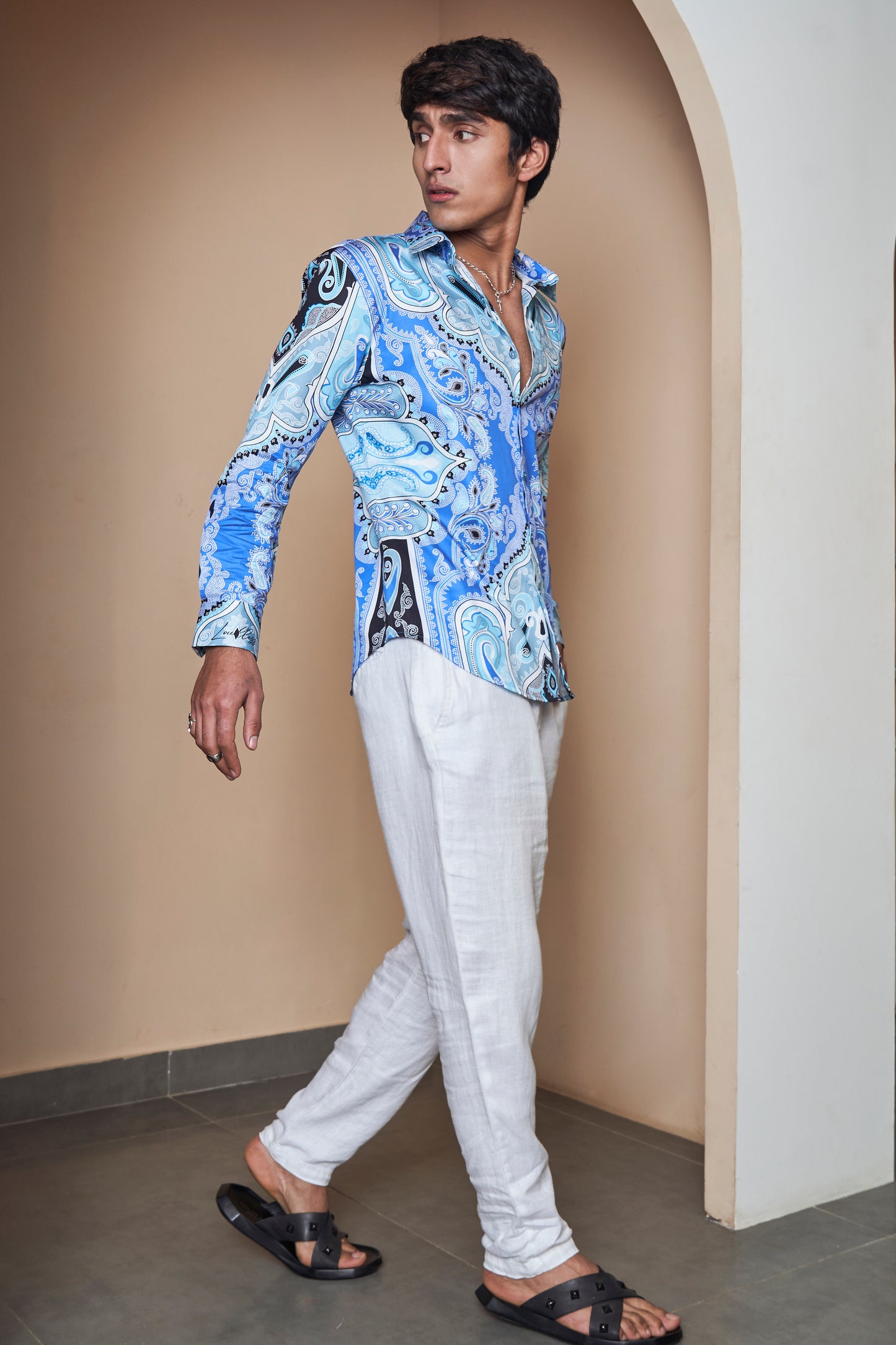 Model wearing the Blue Paisley Printed Cotton Shirt by LoudLess with shorts and sandals